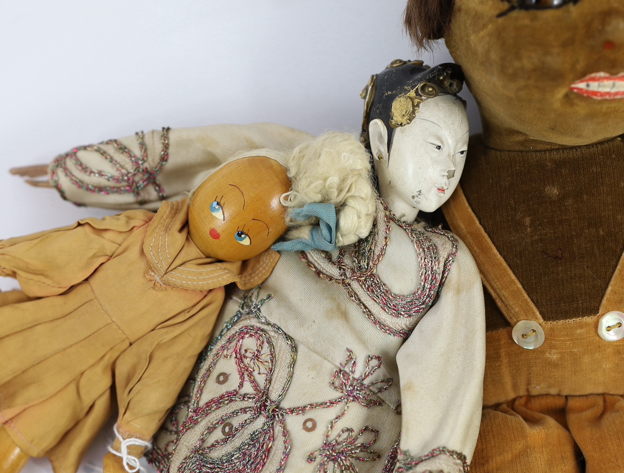 A Norah Wellings-type South Sea Island doll, 13in., three Steiff puppets, Japanese gofun doll, etc.